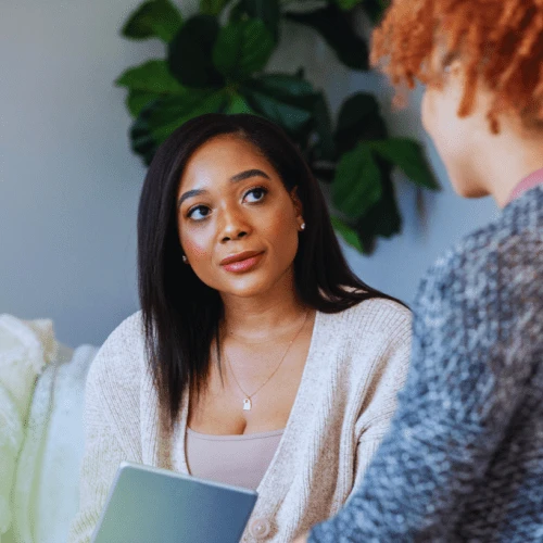 A counselor attentively listening to a client during a one-on-one session, highlighting the personalized care offered by Berea, Kentucky Drug and Alcohol Rehab Resources.