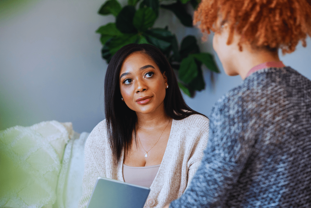 A counselor attentively listening to a client during a one-on-one session, highlighting the personalized care offered by Berea, Kentucky Drug and Alcohol Rehab Resources.