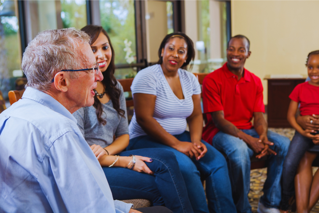 A diverse group of individuals engaged in a therapy session, highlighting community support in the recovery process as part of Paris Kentucky Drug and Alcohol Rehab Resources.