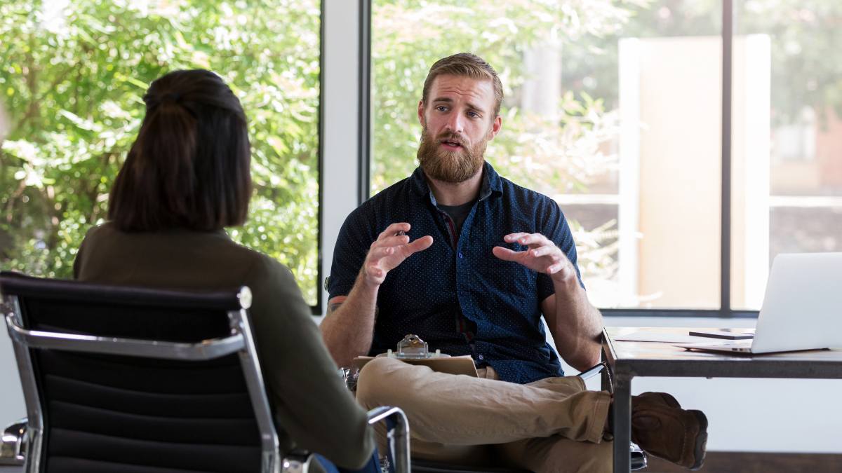Specialist helping client to understand how rehab works and what to bring to rehab.