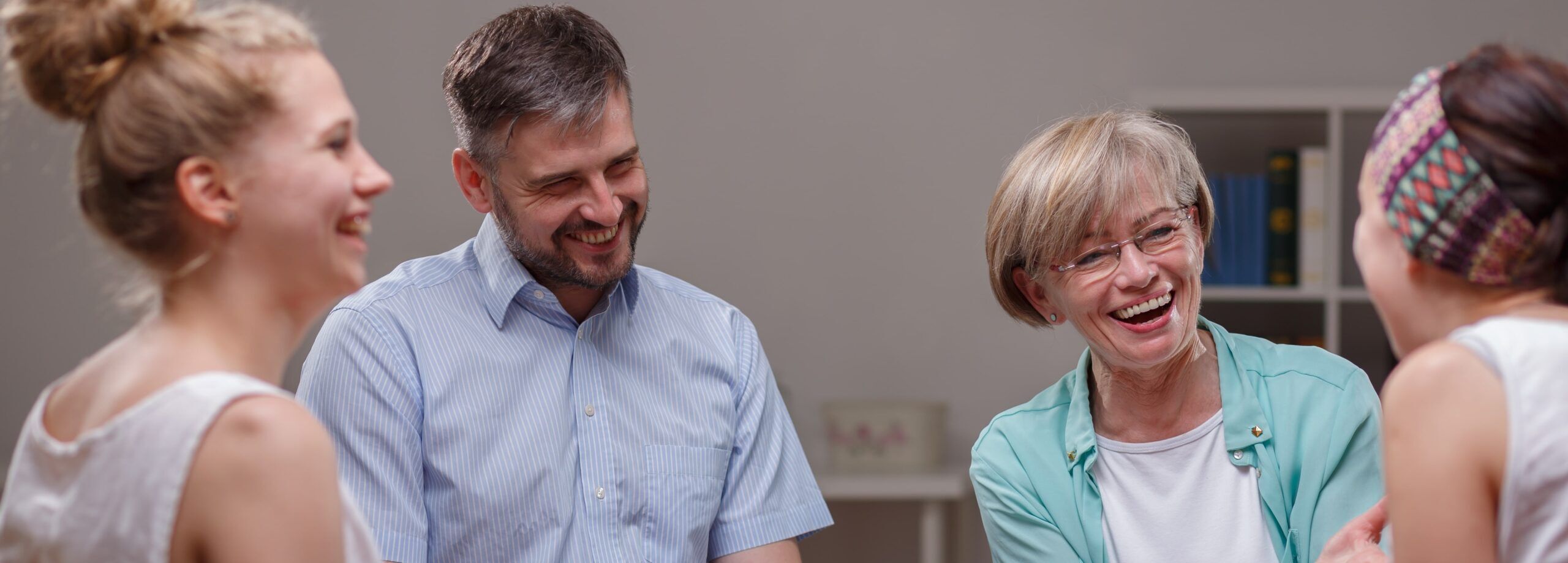 smiling clients together in a group therapy session