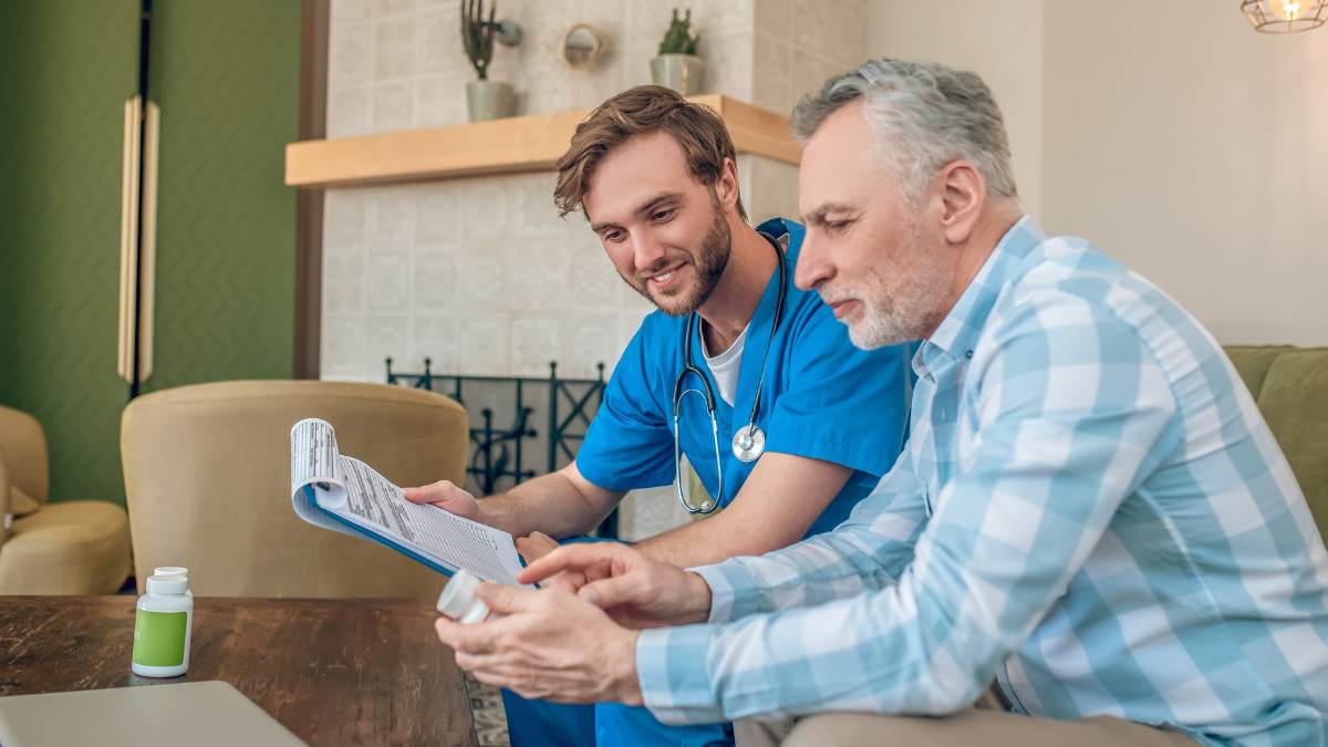 Healthcare professional helping client through addiction recovery questions and answers, as they undergo medication-assisted treatment. 