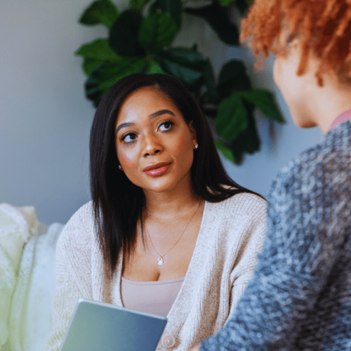 A counselor attentively listening to a client during a one-on-one session, highlighting the personalized care offered by Berea, Kentucky Drug and Alcohol Rehab Resources.