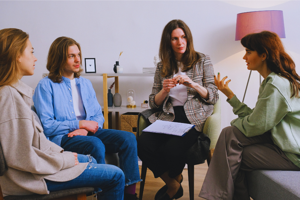 A small, intimate counseling session at Lancaster, Kentucky Drug and Alcohol Rehab Resources. A counselor facilitates communication between individuals as they share their experiences with recovery.