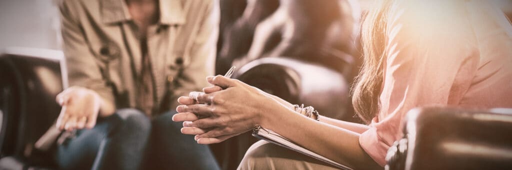 A therapist discussing addiction questions during an individual treatment session.