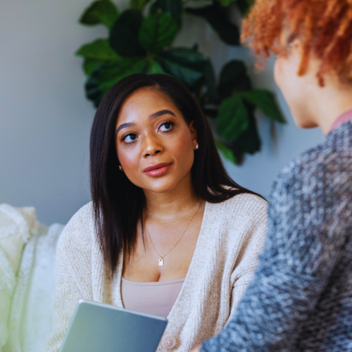 A counselor attentively listening to a client during a one-on-one session, highlighting the personalized care offered by Berea, Kentucky Drug and Alcohol Rehab Resources.